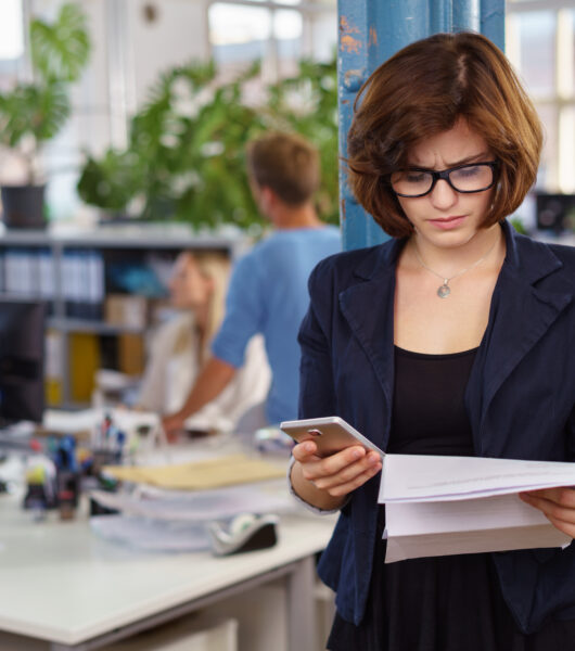 Businesswoman,Reading,A,Document,In,The,Office,As,She,Prepares Businesswoman,Reading,A,Document,In,The,Office,As,She,Prepares