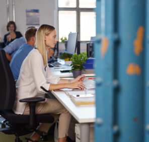 Side,View,Of,Young,Woman,Work,Among,Colleagues,In,Open Side,View,Of,Young,Woman,Work,Among,Colleagues,In,Open